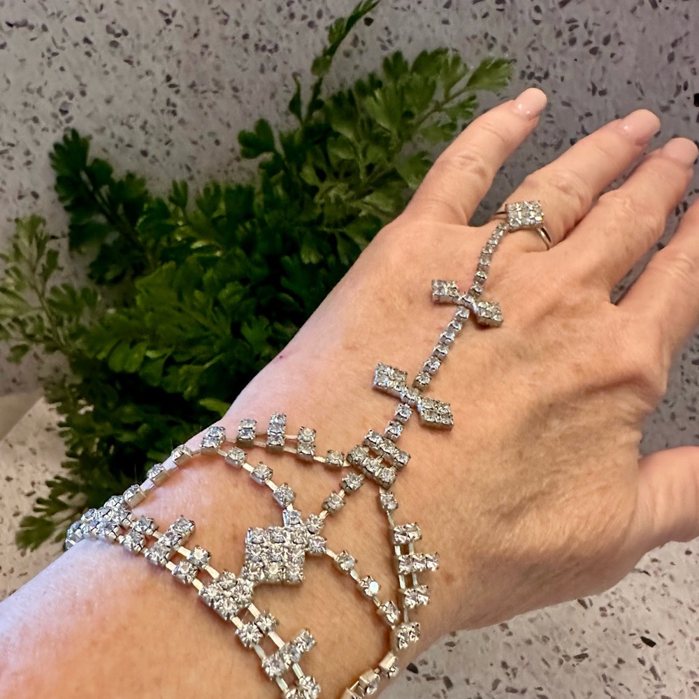 Rhinestone wristlet (bracelet to ring) in silver tone